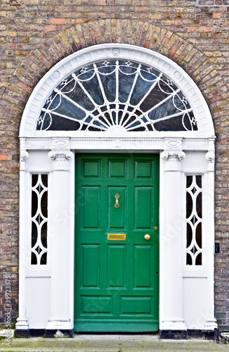 A typical green painted georgian wooden door in the Merrion Square neighborhood