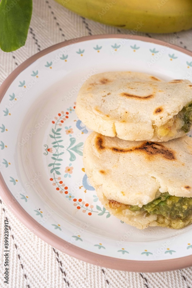 Venezuelan Arepas filled with cheese, banana and avocado. Venezuelan Arepas filled with cheese, banana and avocado.