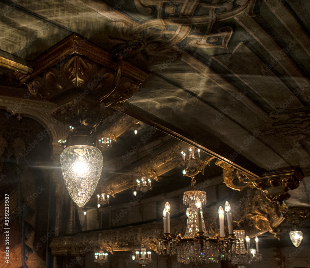 Obraz premium the interior of the theater, corridors in the foyer, armchairs and chandeliers in the hall.