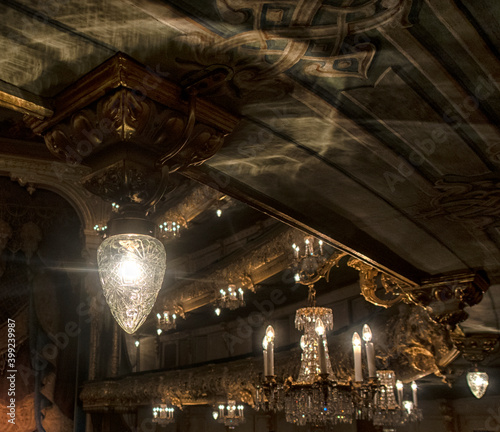 the interior of the theater, corridors in the foyer, armchairs and chandeliers in the hall.
