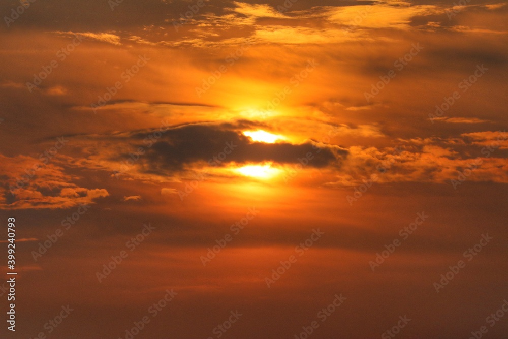 Sunrise with orange and black clouds