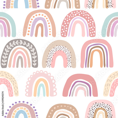 Vector seamless pattern with hand drawn cute rainbows. Simple design for child textile, decoration, wallpaper, stationery.