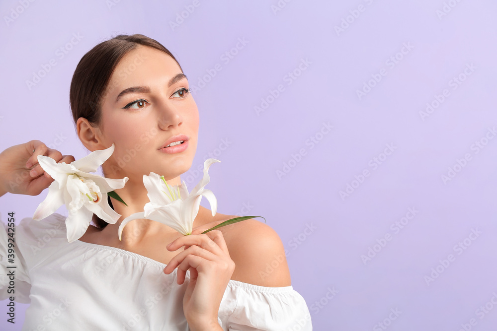 Beautiful young woman with fresh lilies on color background Beautiful young woman with fresh lilies on color background