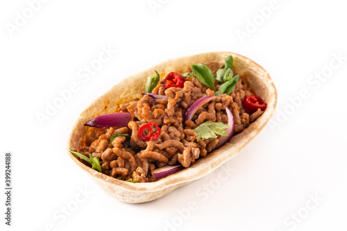 Mexican barquita taco with beef, chilli, tomato, onion and spices isolated on white background