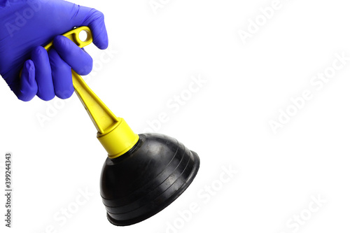 Rubber toilet plunger in hand with glove isolated on white