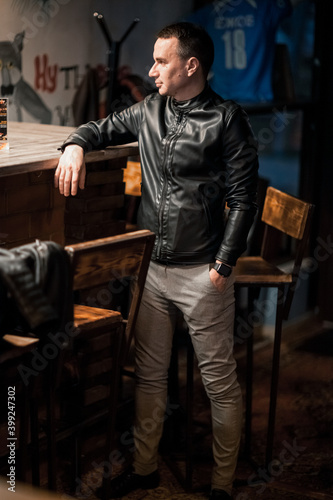 Portrait of a handsome young man. Shooting in a bar