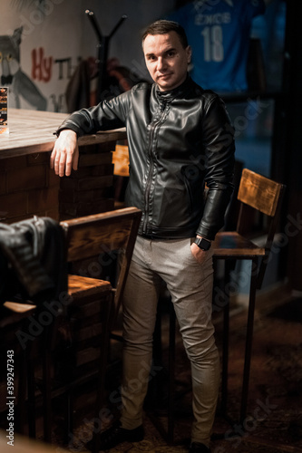 Portrait of a handsome young man. Shooting in a bar © algrigo