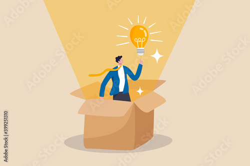 Think outside the box, creativity to create different business idea or motivation and innovation concept, smart businessman get out of paper box with new illumination lightbulb idea.