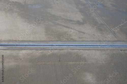 expansion joint on the concrete roof which serves as a parking lot. dilatation consists of a rubber strip with a metal stainless steel cover