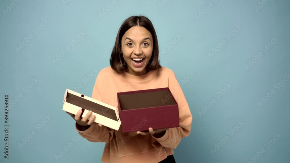 man surprised and holding a gift man surprised and holding a gift