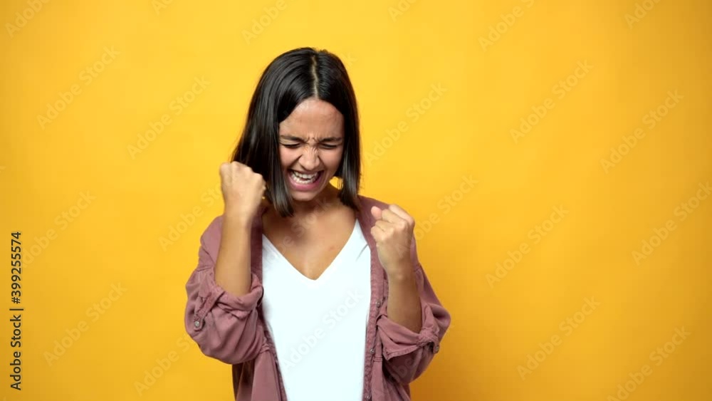 woman celebrating a victory and surprised to be successful woman celebrating a victory and surprised to be successful