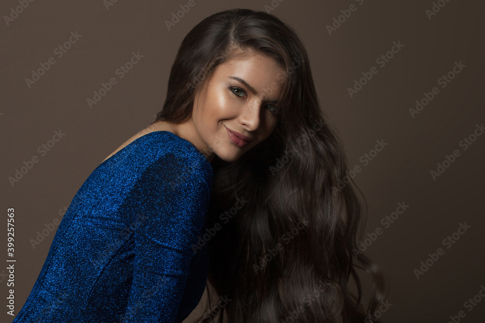 Young model woman brunette with healthy hairstyle on brown background, fashion beauty portrait