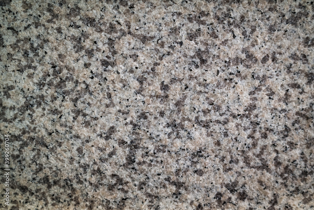 Rough-textured hard granite surface background Rough-textured hard granite surface background
