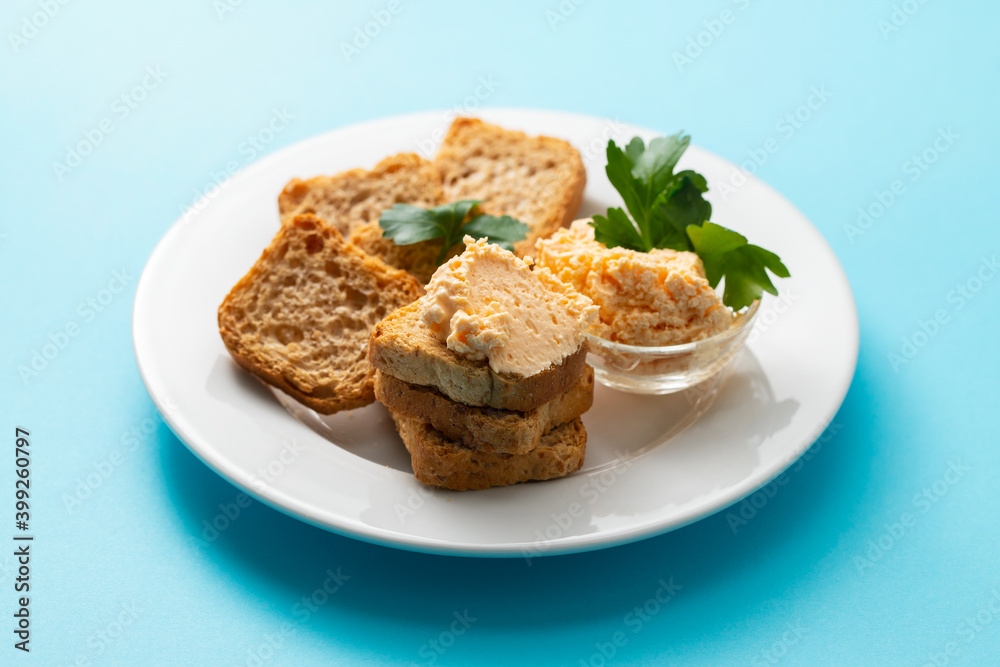 toasts with fish pate on white plate toasts with fish pate on white plate