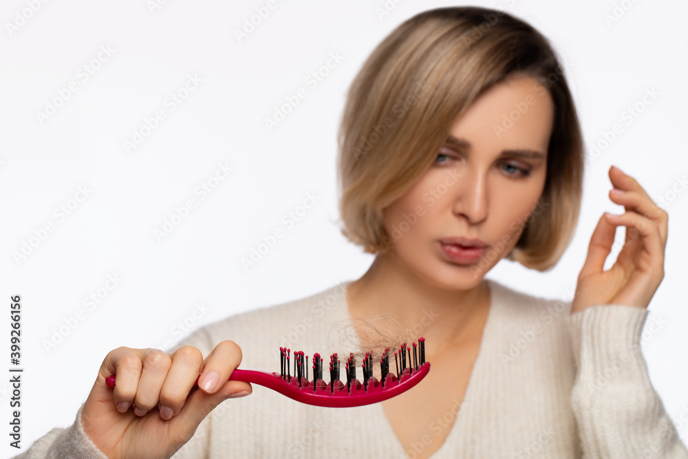 Hair fall problem. Young caucasian woman with comb and problem hair on white background. Beautiful girl looking hair loss from comb. Hair care and beauty concepts. isolated.Wad of Hair. - Image Hair fall problem. Young caucasian woman with comb and problem hair on white background. Beautiful girl looking hair loss from comb. Hair care and beauty concepts. isolated.Wad of Hair. - Image