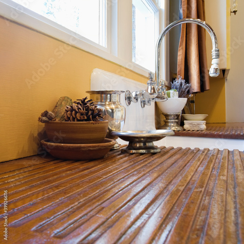 Wooden draining board and kitchen sink.