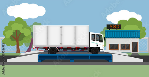 Large trucks carrying cargo open side. on the weighing scale. Control station building on the front.