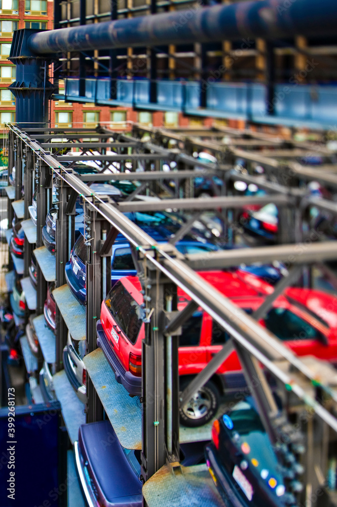 Cars stored in large metal lift. Cars stored in large metal lift.