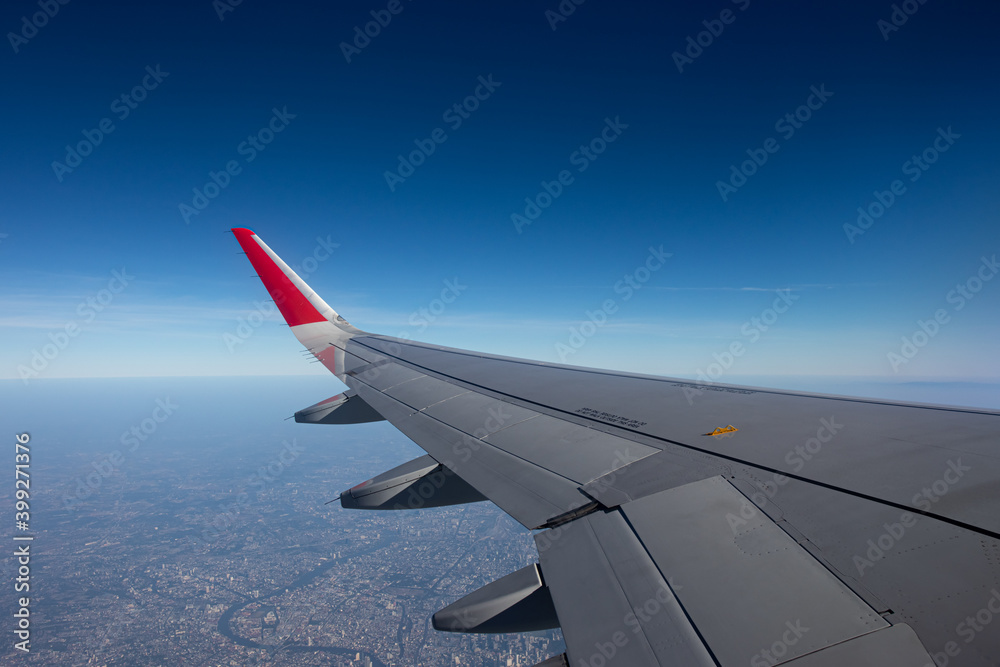 Wing of the plane on blue sky Wing of the plane on blue sky