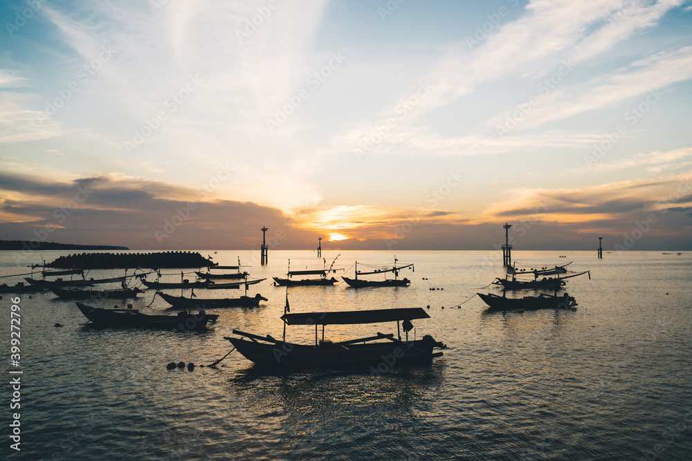 Picturesque view of boats on sunset