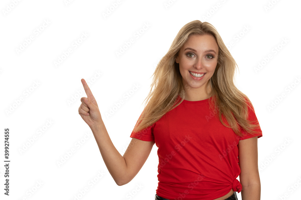 Beautiful young woman in red tshirt point in copy space Beautiful young woman in red tshirt point in copy space