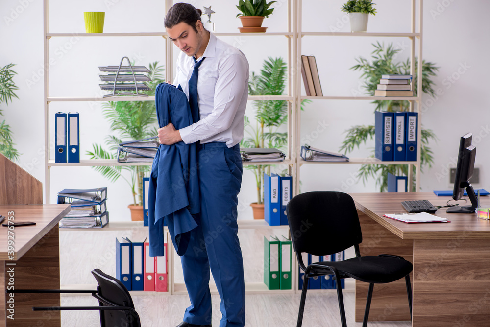 Young male employee businessman at workplace Young male employee businessman at workplace