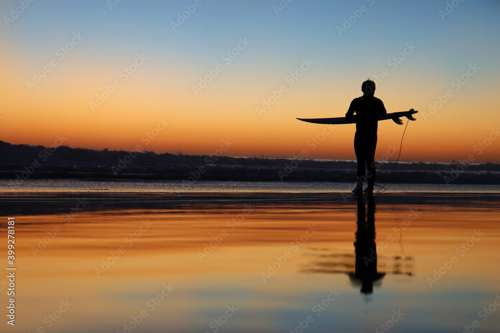 Surfing with a sunset view 