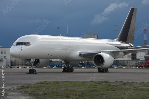 Cargo freighter airplane parked at an airport, blank white body