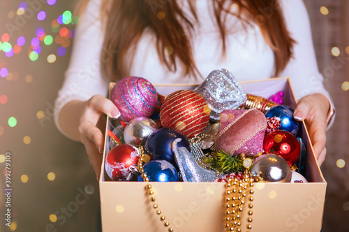 Woman with a box of Christmas decorations