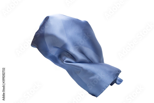 Flowing blue silk scarf isolated on white background.