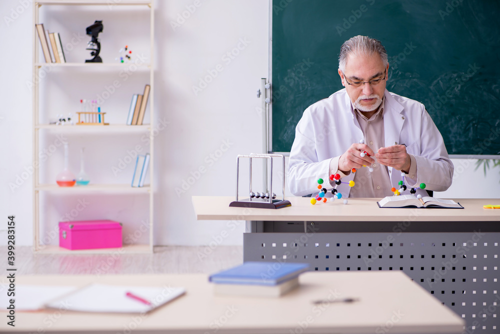 Experienced old scientist working in the lab Experienced old scientist working in the lab