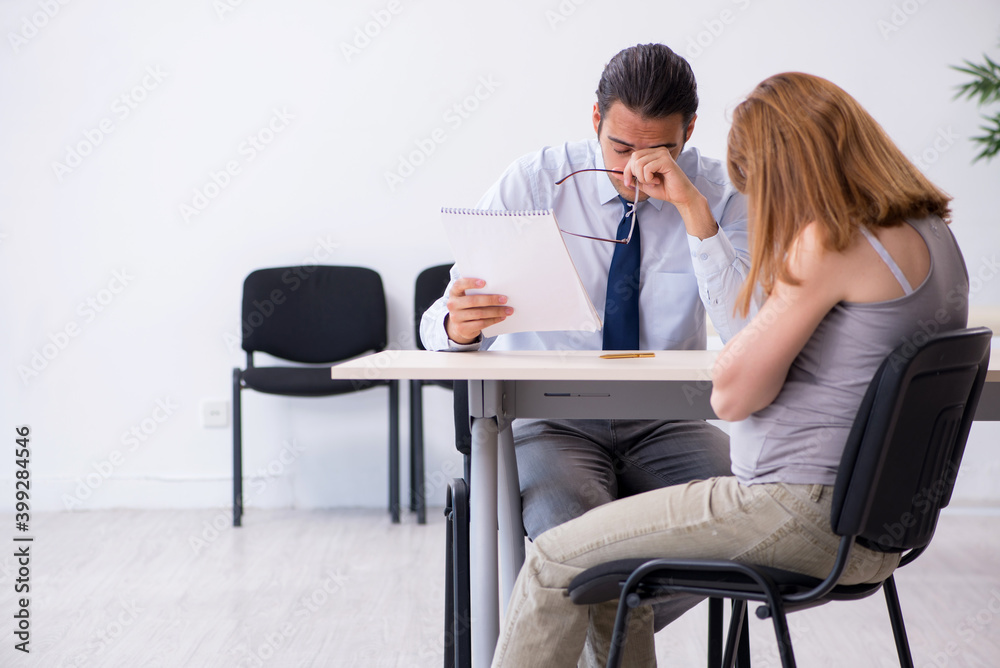 Pregnant woman visiting male psychologist doctor Pregnant woman visiting male psychologist doctor