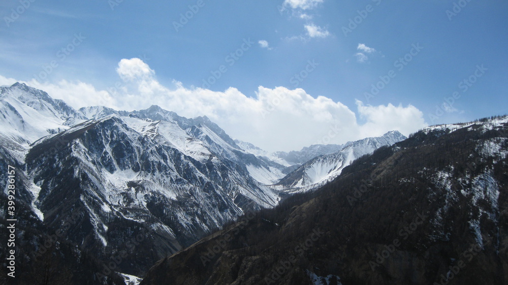 Panorama of the mountain with snowy peaks. The nature of Russia. Mountaineering.