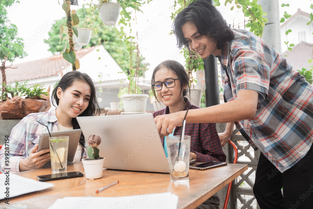 Portrait of young asian students meeting in a cafe