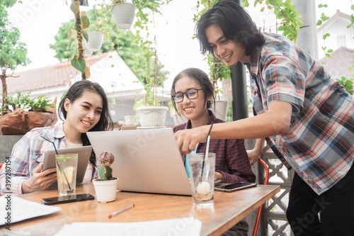 Portrait of young asian students meeting in a cafe