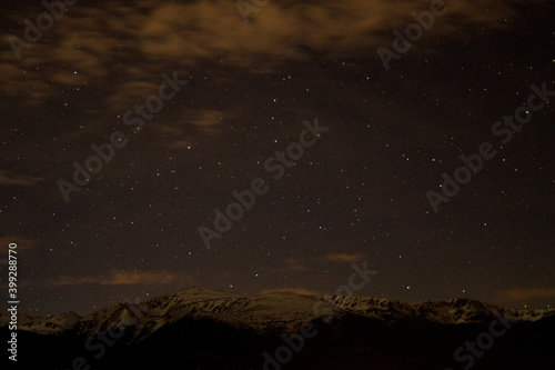 Snow on a dark night sky