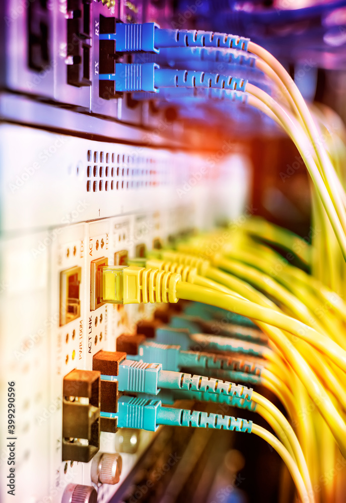 Fiber Optical cables connected to an optic ports and Network cables ...