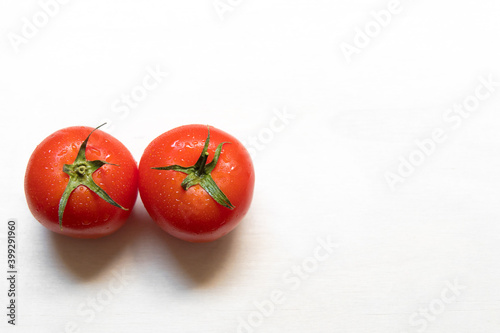 Ripe red tomato on white background