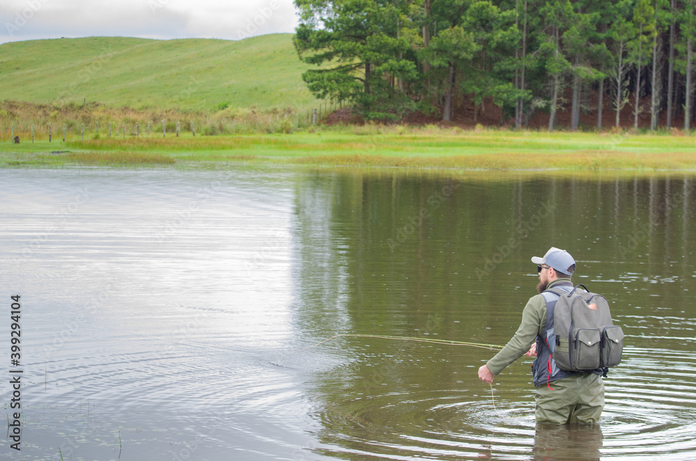 Black bass fisherman fishing inside lake Black bass fisherman fishing inside lake