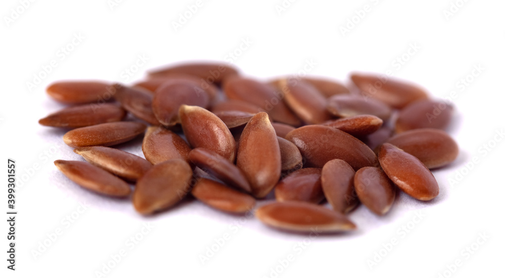 Close-up of flax seeds isolated on white background Close-up of flax seeds isolated on white background