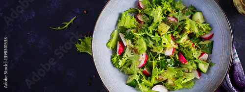 Photography Fresh healthy salad of cucumbers, radishes and herbs with mustard-honey dressing