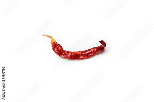 Dry single alone red hot chilli pepper isolated on the white background