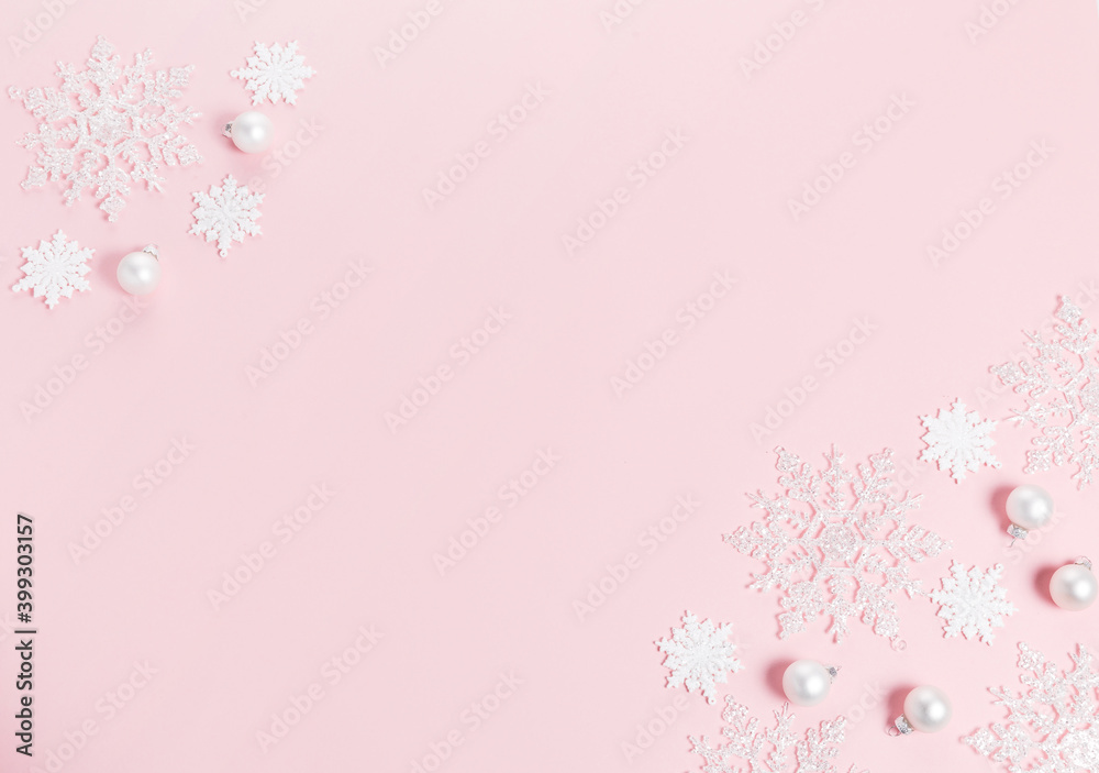 White Christmas holiday composition. Festive creative white pattern, xmas decor holiday ball with snowflakes on pink background.