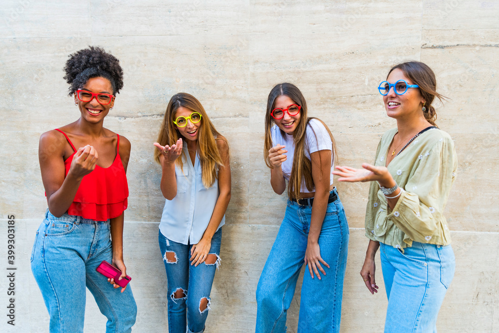 Fototapeta premium Happy young people holding fake eyeglasses