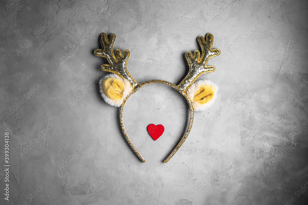 Christmas deer antlers on grey concrete background Christmas deer antlers on grey concrete background