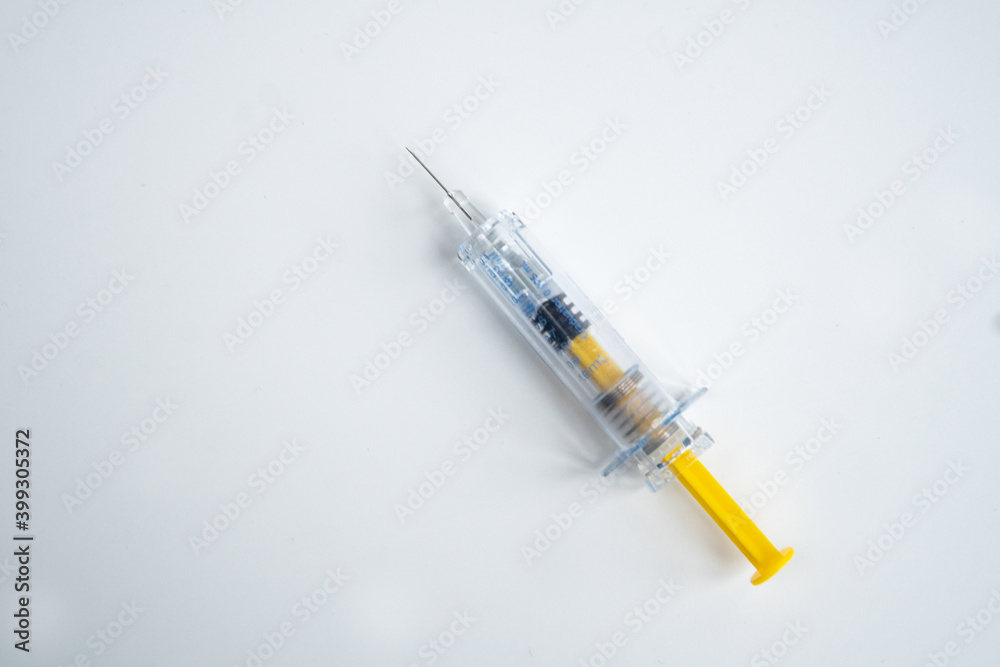 Syringe on white background for injection. Healthcare and Medical concept for covid-19. Covid-19 coronavirus vaccination concept. It use for immunization and treatment. Flat lay, top view, copy space. Syringe on white background for injection. Healthcare and Medical concept for covid-19. Covid-19 coronavirus vaccination concept. It use for immunization and treatment. Flat lay, top view, copy space.