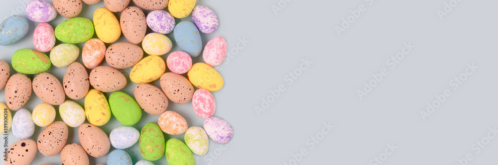 Pattern made of colorful easter eggs on a blue pastel background. Holiday creative concept. Pattern made of colorful easter eggs on a blue pastel background. Holiday creative concept.