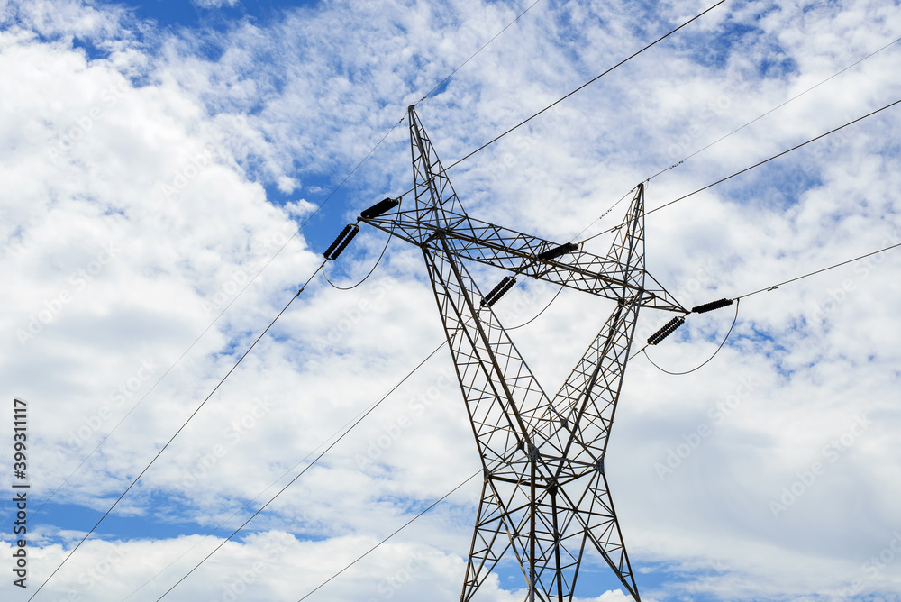 High voltage transmission towers and cloud background