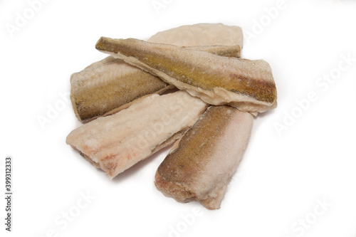 Large slices of raw fish hake on a white background.Menu concept, fish day. Isolate. Copyspace