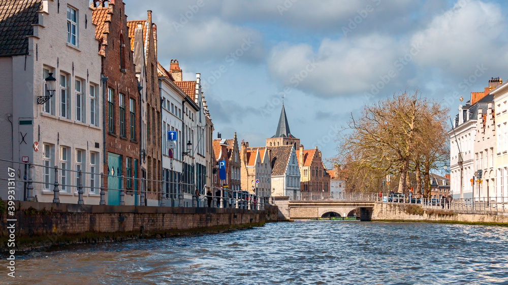 picturesque old houses along the banks of the river in the historical part of Bruges. Belgium